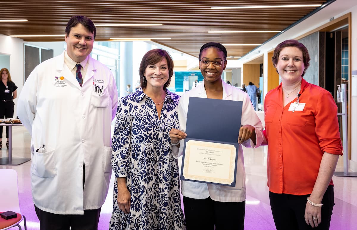 Congratulating medical student Deja Pegues, third from left, are, from left, Dr. David Gilliam, Dr. Mary Taylor and Dr. Cindy Karlson.